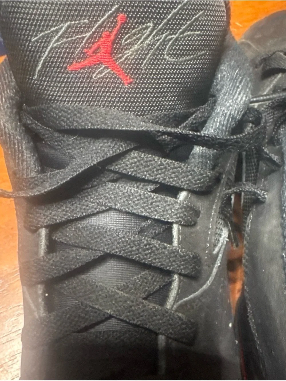 Jordan Black Sneakers with Red Jumpman Accent